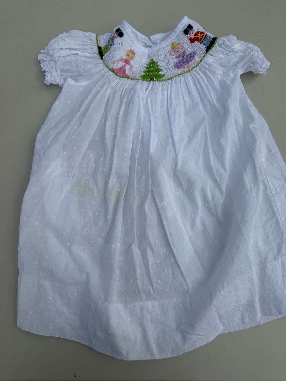 White Smocked Baby Dress with Princess Motif